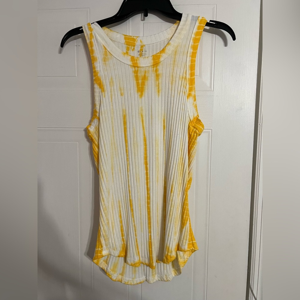 A form fitted, yellow and white tank top